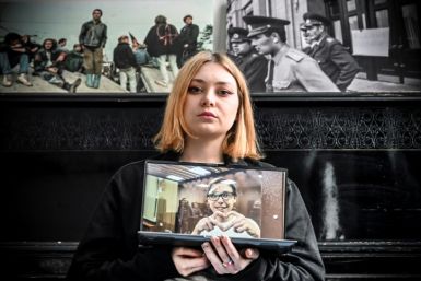 Alexandra Popova, the wife of jailed Russian poet Artyom Kamardin, says she is afraid "they will kill him" in prison