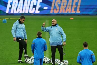 Israel head coach Ran Ben Shimon addresses his players in training before their match against France at the Stade de France in Paris on Thursday