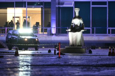 Police block off the scene where a man died after an explosion in front of Brazil's Supreme Federal Court, in Brasilia, on November 13, 2024