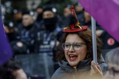 Protesters take part in a demonstration to mark the International Day for Elimination of Violence Against Women, in Istanbul