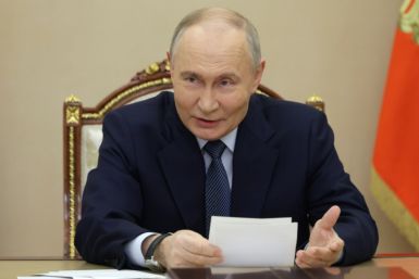 Russian President Vladimir Putin has signed a law allowing those who fight in Ukraine to write off debts of up to nearly $100,000