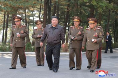 This picture taken on October 17, 2024 and released by Korean Central News Agency shows North Korea's leader Kim Jong Un (C) visiting the command of the 2nd Corps of the Korean People's Army