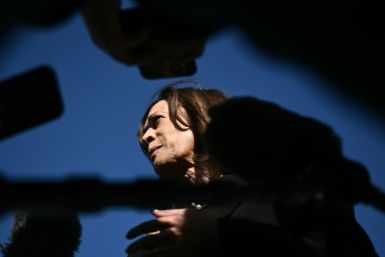 US Vice President and Democratic presidential nominee Kamala Harris talks to reporters before boarding Air Force Two at Joint Base Andrews in Maryland on October 30, 2024.