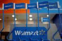 Walmart signs are displayed inside a Walmart store in Mexico City